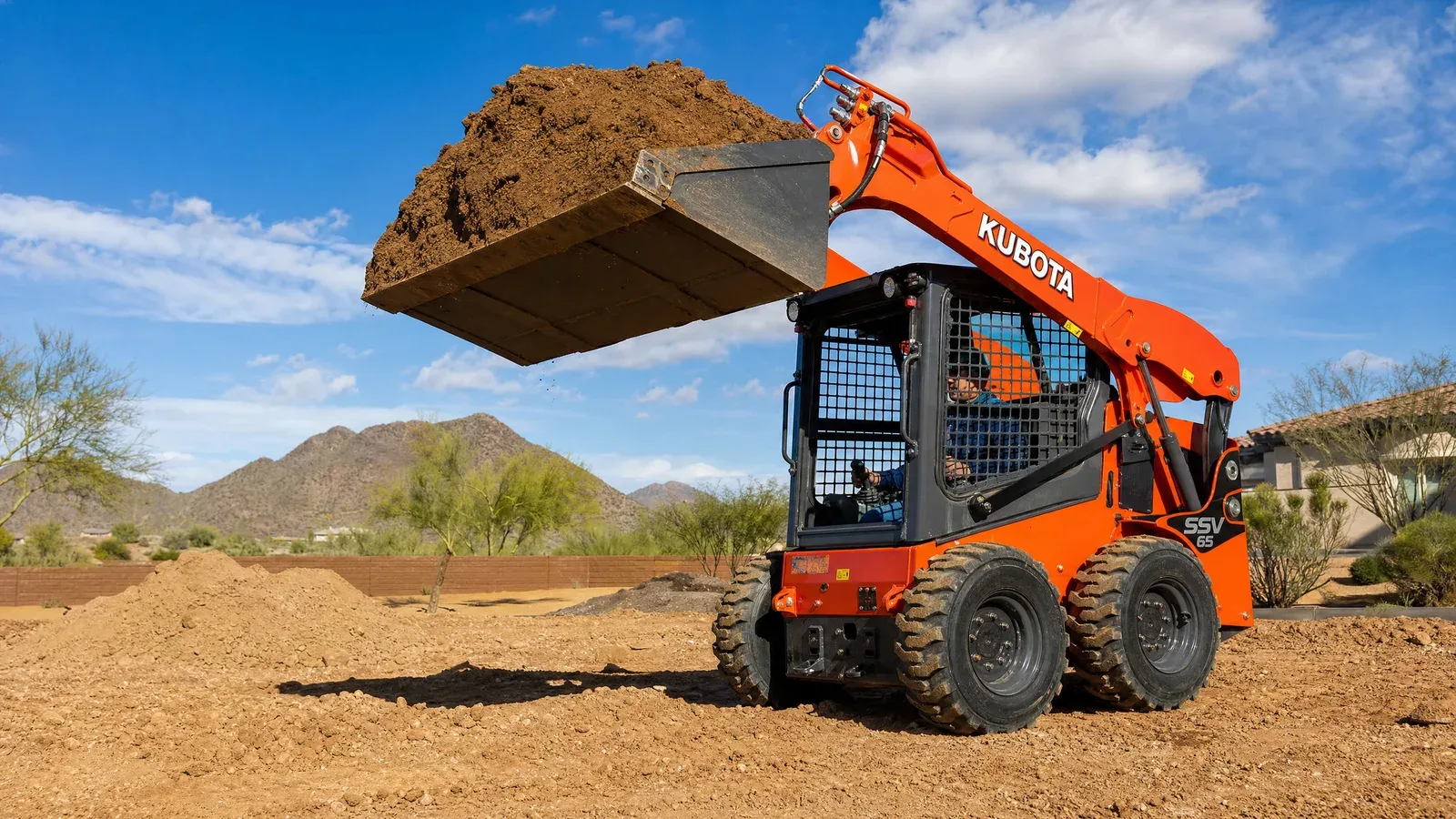 Kubota SSV65 heavy-duty skid steer rental from Valley Skid Steer Rental with enclosed cab